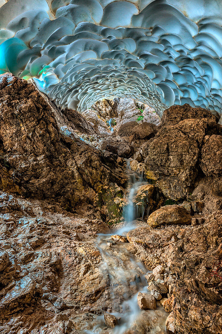 Italy, Veneto, Cortina d'Ampezzo, Sorapiss lake, inside an ice cave carved by water.