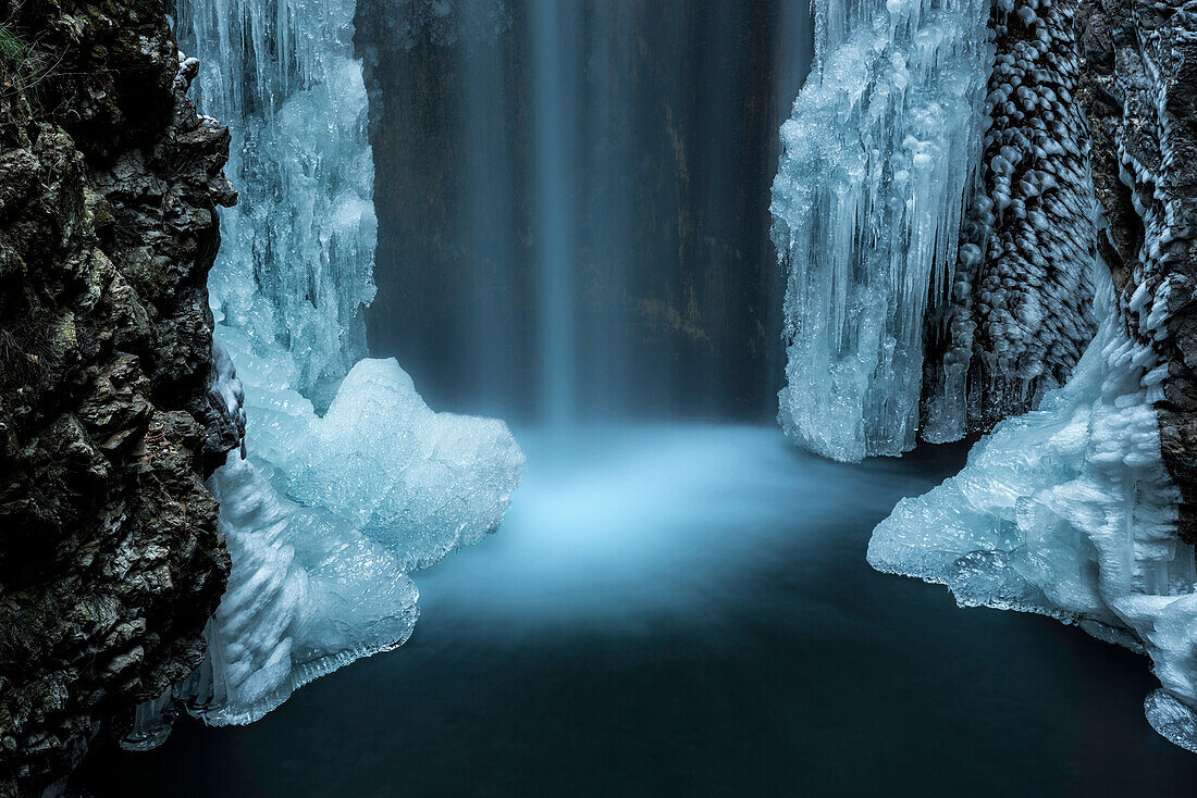 Waterfall from Smeraldo lake in winter, Non Valley, Trentino Alto Adige, Italy.