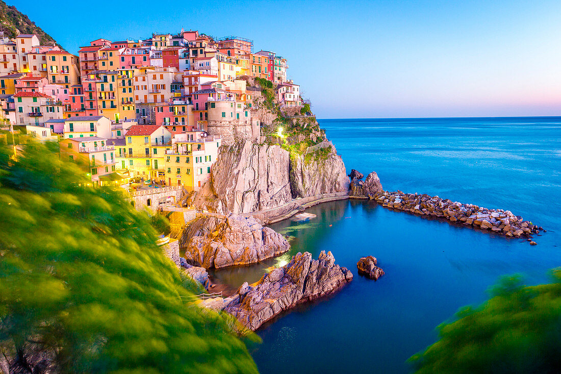 Manarola, Cinque Terre, Liguria, Italy. Sunset over the town, view from a vantage point