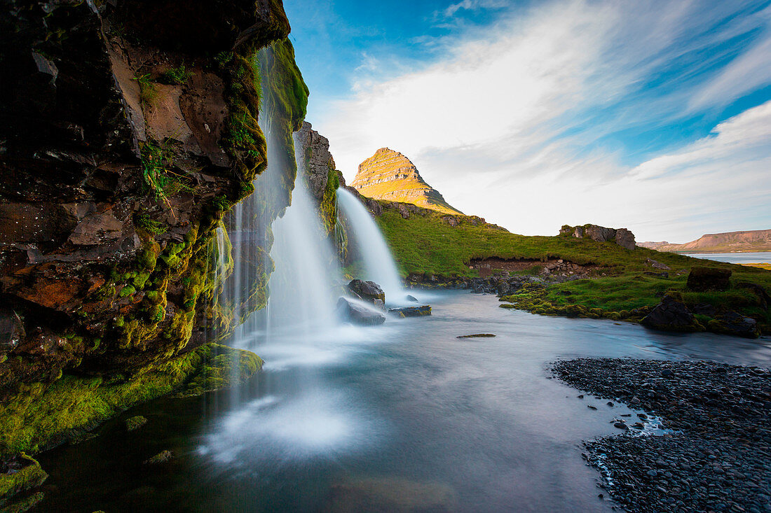 Kirkjufell Mountain, Snaefellsnes peninsula, Iceland. Landscape with waterfalls, long exposure in a sunny day