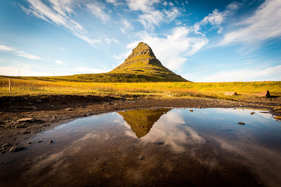 Kirkjufell Mountain, Snaefellsnes peninsula, Iceland. Landscape with waterfalls, long exposure in a sunny day