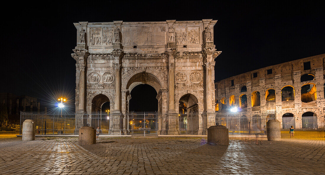 Arch of Costantine and Colosseum by night, Rome, Lazio district, Italy