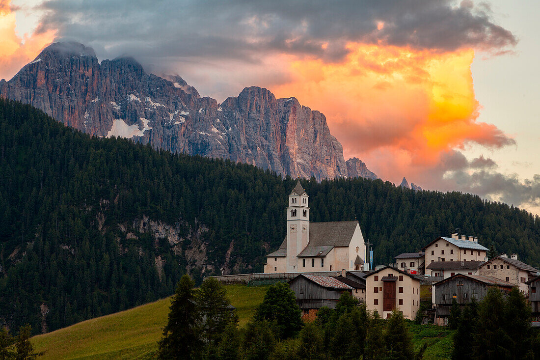 The village of Colle Saint Lucia, in the province of Belluno, perched on a green hill (hence the name) has a beautiful view on two important groups of mountains that form the backdrop: the Pelmo and in the case of this photo the magnificent spiers of the 