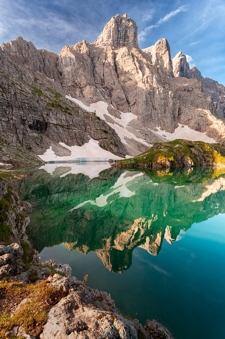 Europe, Italy, Veneto, Belluno. Lake of Coldai, the towers of mount Civetta are reflected in the water, Dolomites