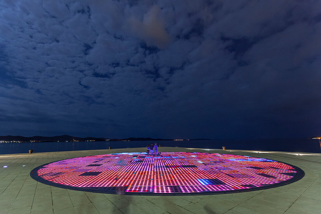 The Greeting to the Sun by the architect Nikola Basic situated right at the top of Zadar peninsula, Croatia. During the day the solar panels capture energy from the sun, while at night they light up creating a light show.