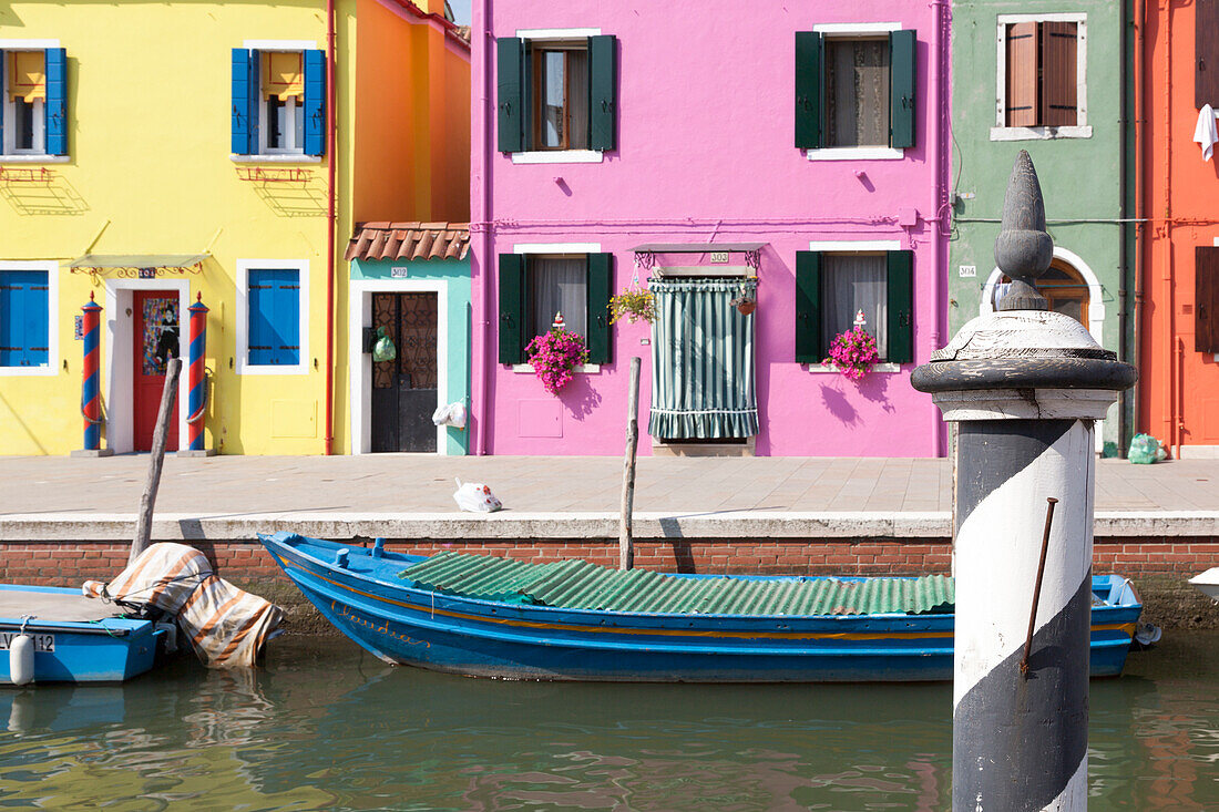 Classic view of the canal and colored houses in Burano. Venice, Veneto, Italy