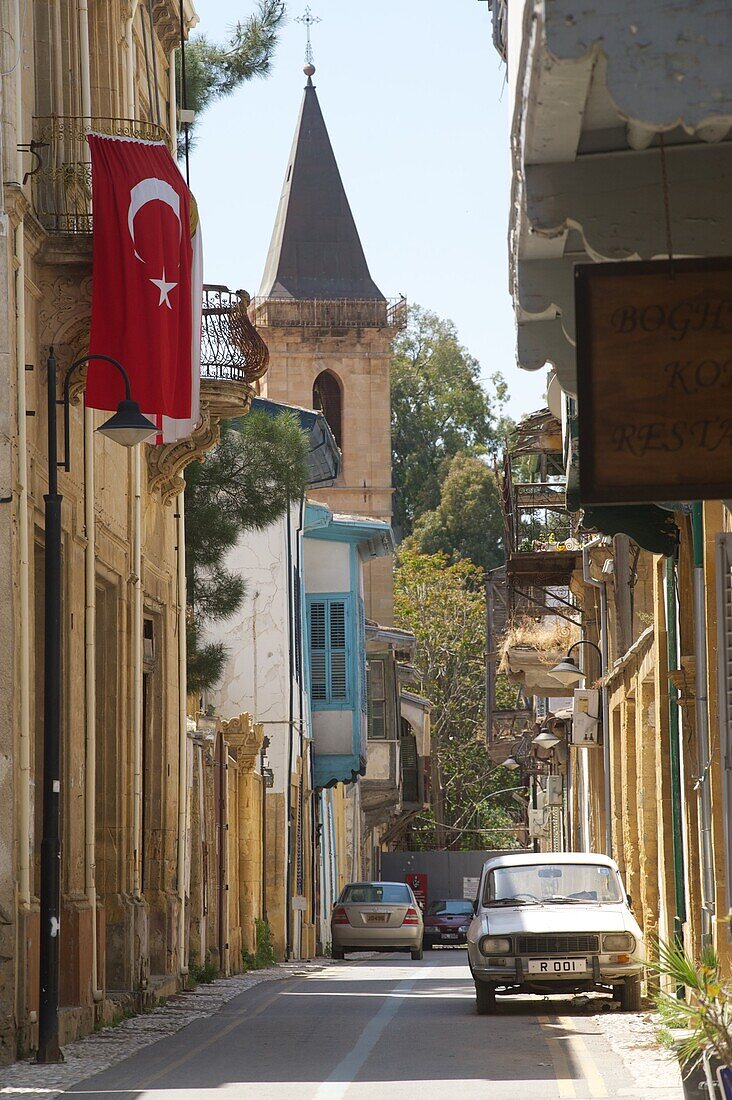 Street blocket by border fence, Turk flag hinging on a balcony, Arabahmet, Lefkosa, Nicosia, North Cyprus