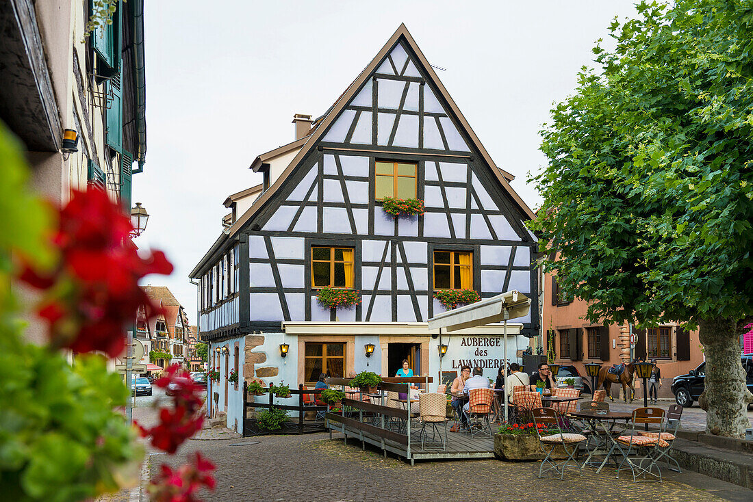 restaurant and colourful half-timbered houses, Bergheim, Alsace, France