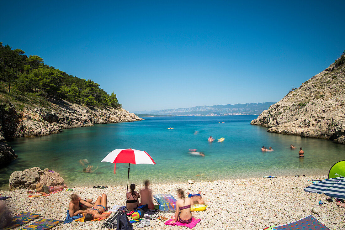 Bay on the pebble beach Kozica with people on the island of Krk in Vrbnik - Croatia, Island Krk