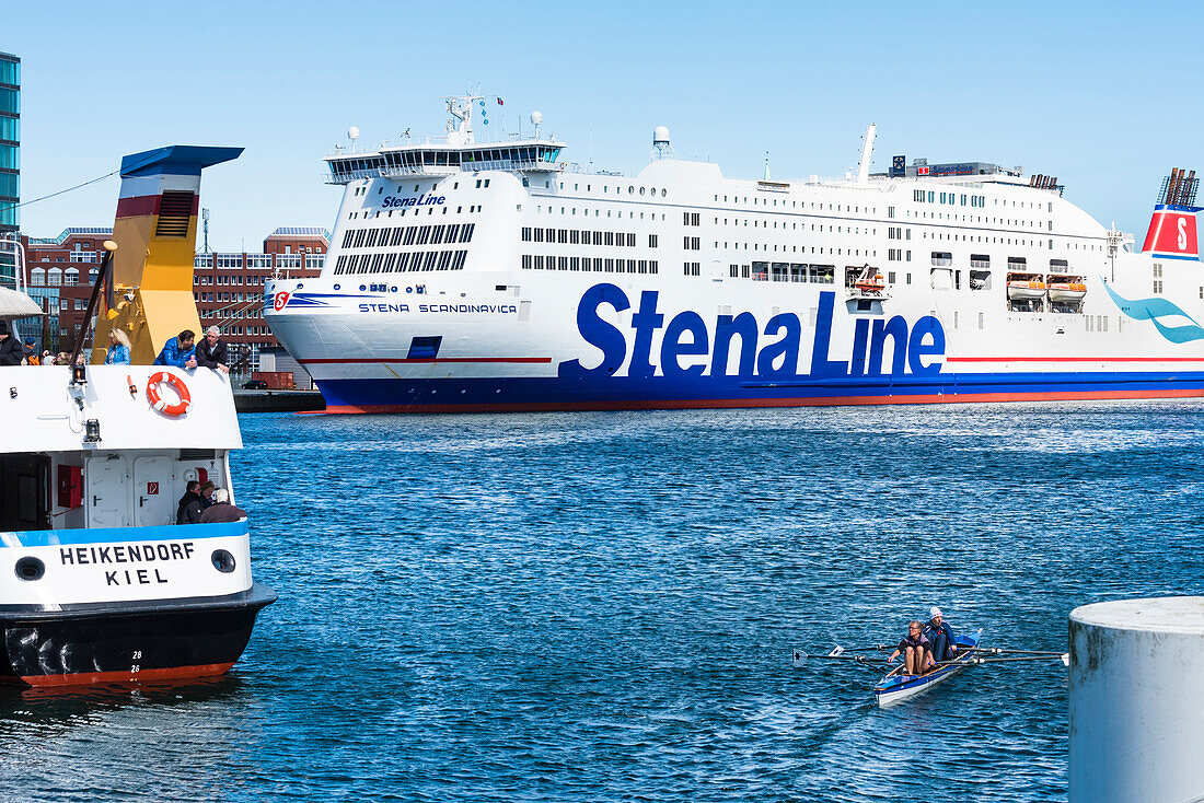 Rower, the ferry to Sweden and the passenger ferry on the Kieler Förde in the harbour, Kiel, Schleswig Holstein, Germany