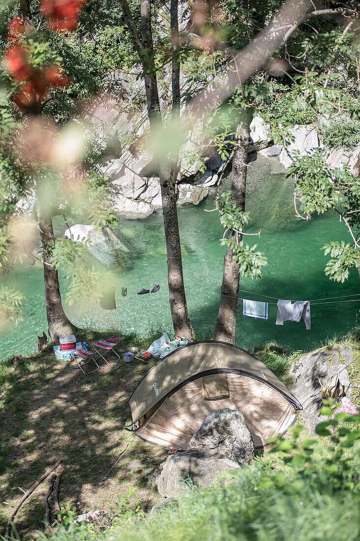Camp and zelt along the banks of a river, Valle Verzasca, Ticino, Switzerland