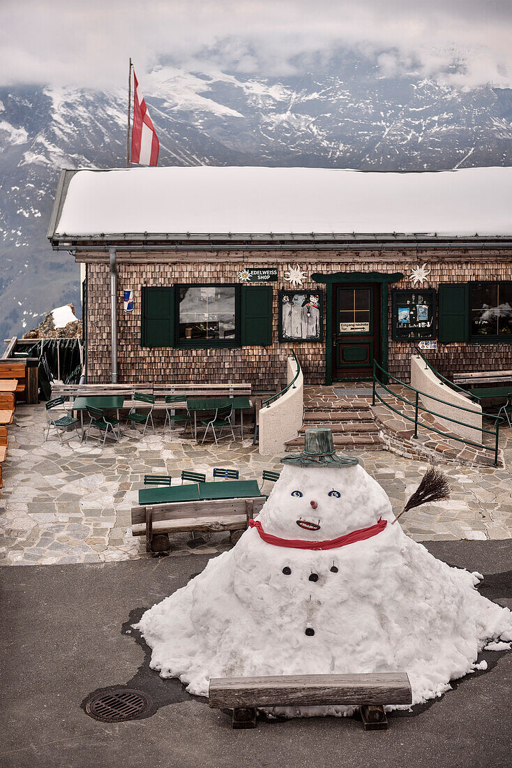 Bobba Fat snowman in front of Alpine hut, Grossglockner high Alpine road, Salzburg / Kaernten, Austria, Europe