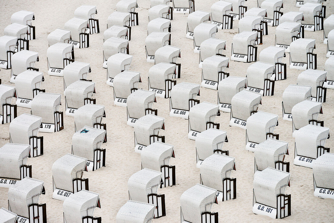 white roofed wicker beach chairs without people, Sellin Baltic Sea coastal resort, Ruegen Island, Mecklenburg-West Pomerania, Germany