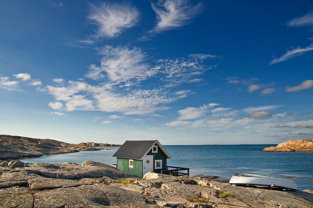 Green wooden house on the sea, Smoegen, Bohuslaaen, Sweden