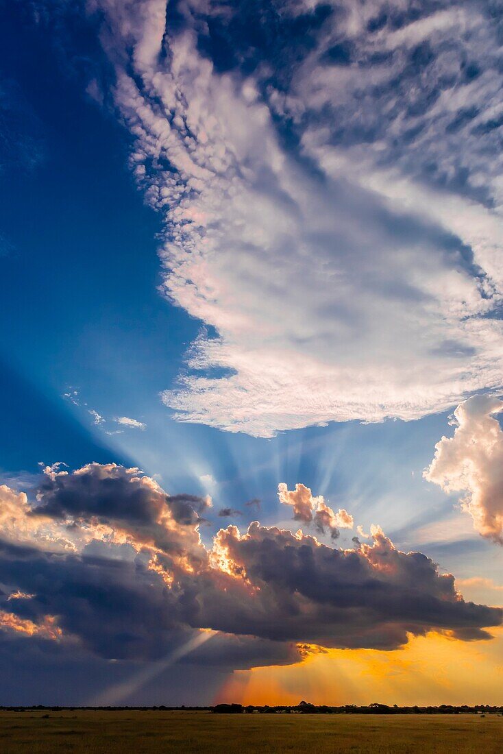 Sunset behind clouds, Nxai Pan National Park, Botswana.