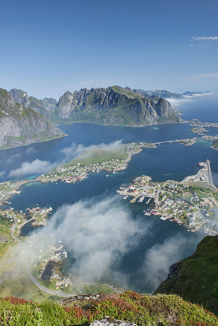 Aerial view over the village of Reine and fjords and mountains in the Lofoten Islands, Norway.