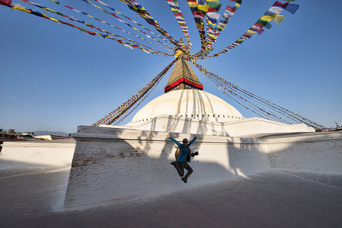 Raquel practicing her vertical jump at the Boudhanath Stupa in Kathmandu, Nepal.