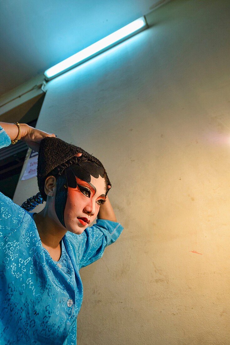 Chinese opera performer prepares for a performance at the Vegetarian Festival in Bangkok, Thailand.