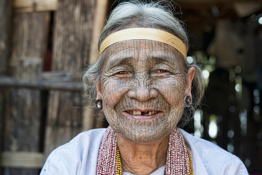 A 90 year old Yindu Chin woman with face tattoos in Kanpetlet, Myanmar. The tribal Chin women had their faces tattooed when they were around 15 years old, purportedly to protect them from being carried away by marauding men. The practice is now banned, an