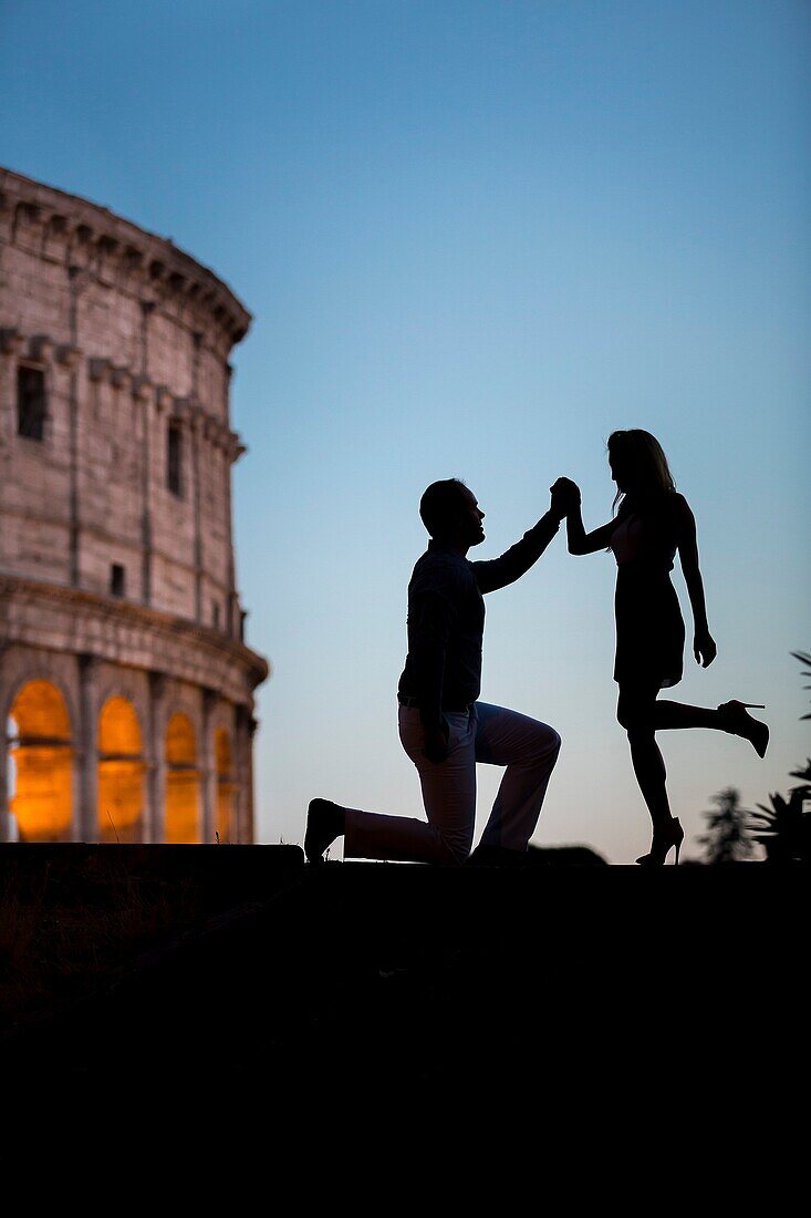 Couple at Roman Colosseum. Rome. Italy.