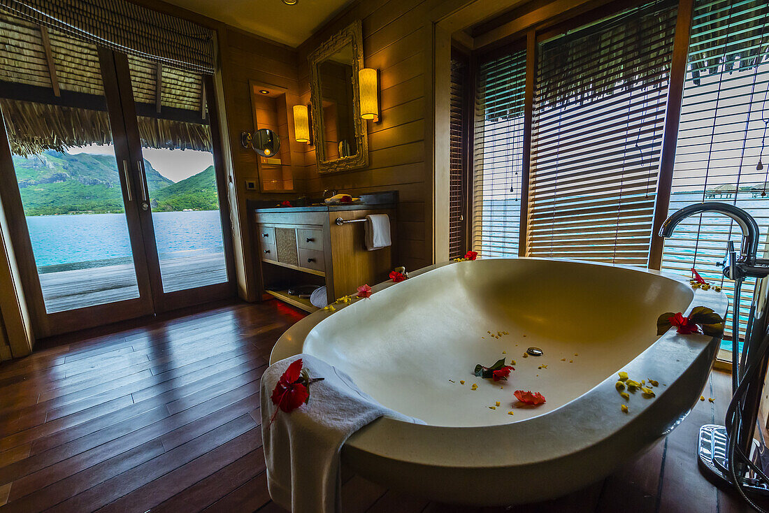 Interior view of Overwater bungalow suite with plunge pool, Four Seasons Resort Bora Bora, French Polynesia.