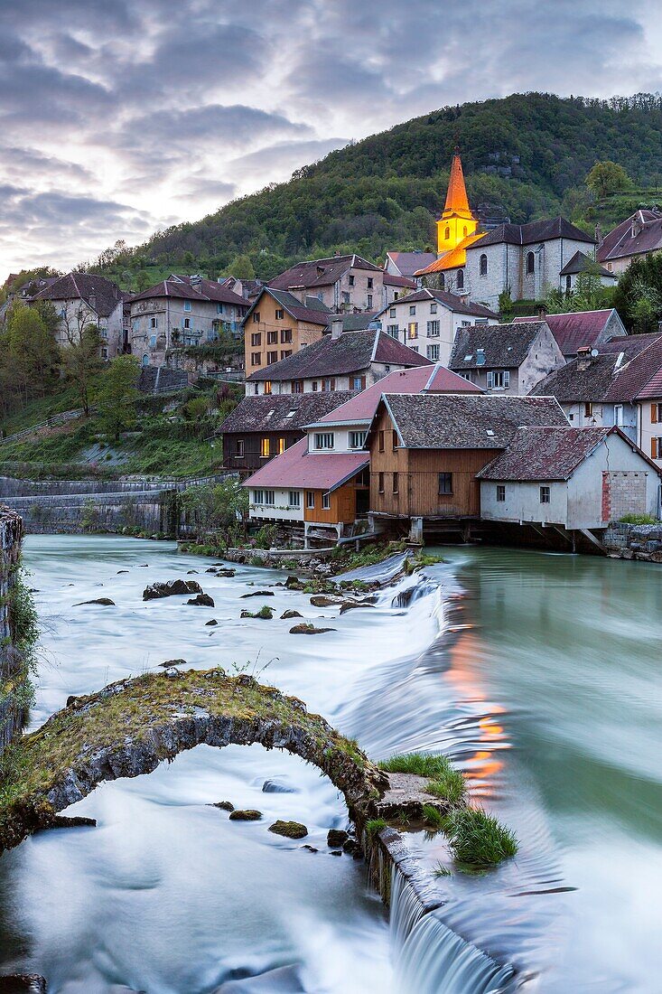 The weir and remains of a medieval bridge on the River Loue, Lods, Franche-Comté, France, Europe.