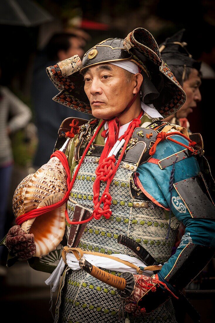 Samuri solodier with conch shell trumpet, Jidai Matsuri festival of the Ages parade Kyoto in autumn, Japan.
