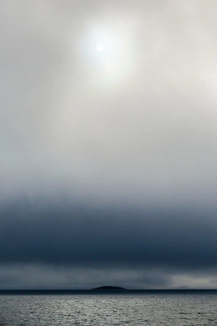 sun shining through the clouds over Arctic Ocean, Hinlopenstretet, Svalbard.