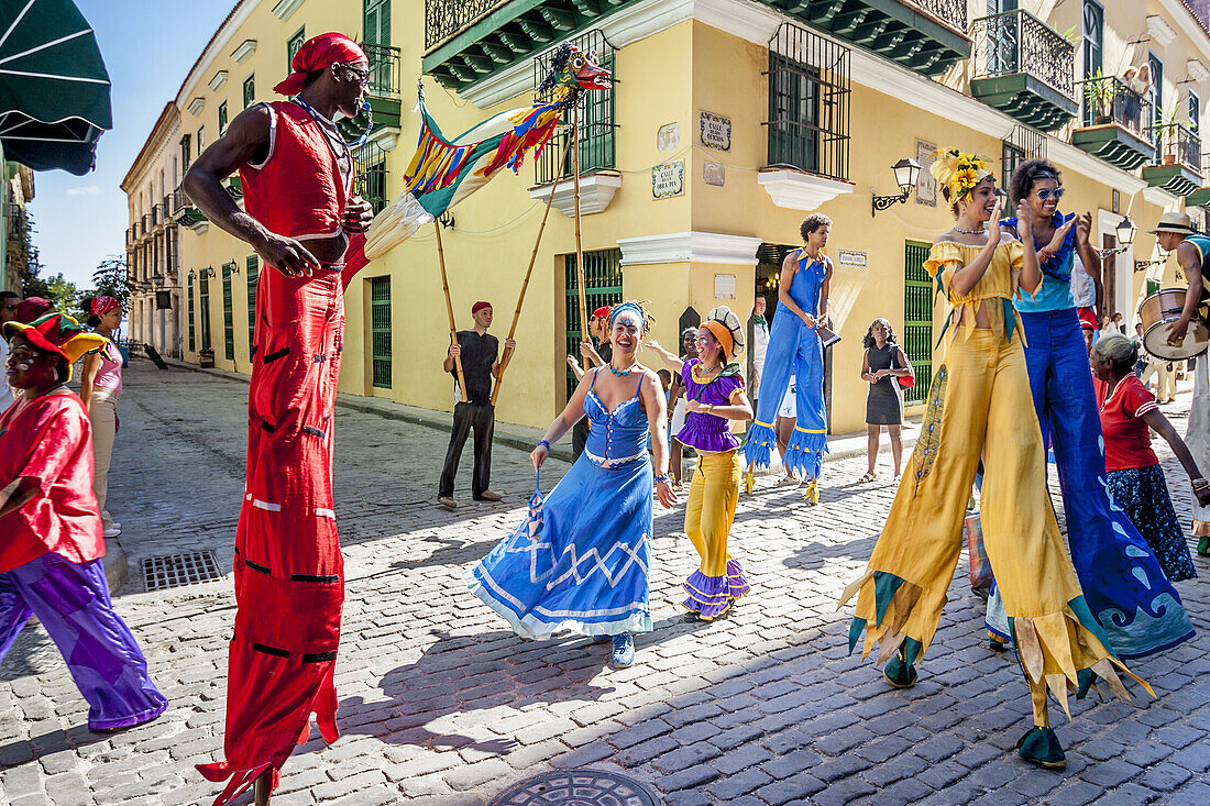 Street Entertainers Dancing On Stilts, Old Havana, Havana, Cuba.