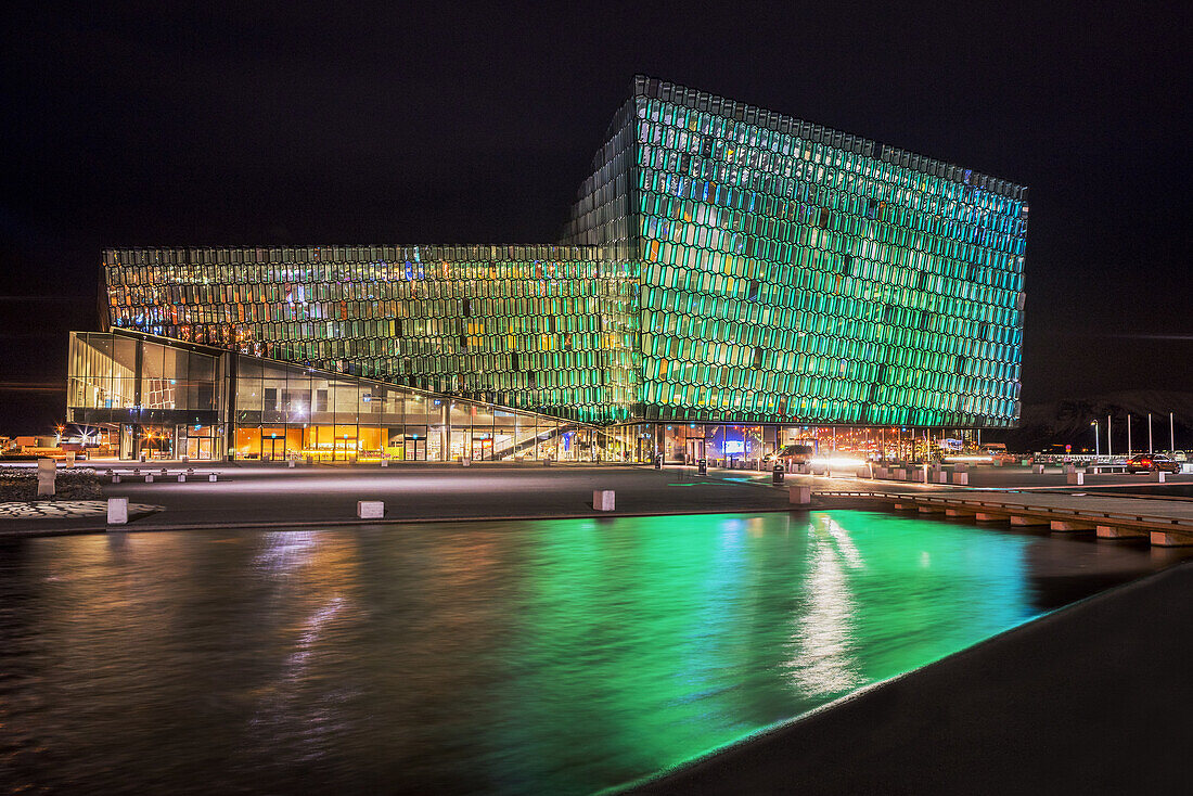 Harpa Concert Hall and Conference Center, Reykjavik, Iceland. Colorful lights are displayed during Reykjavik´s Winter Lights festival.