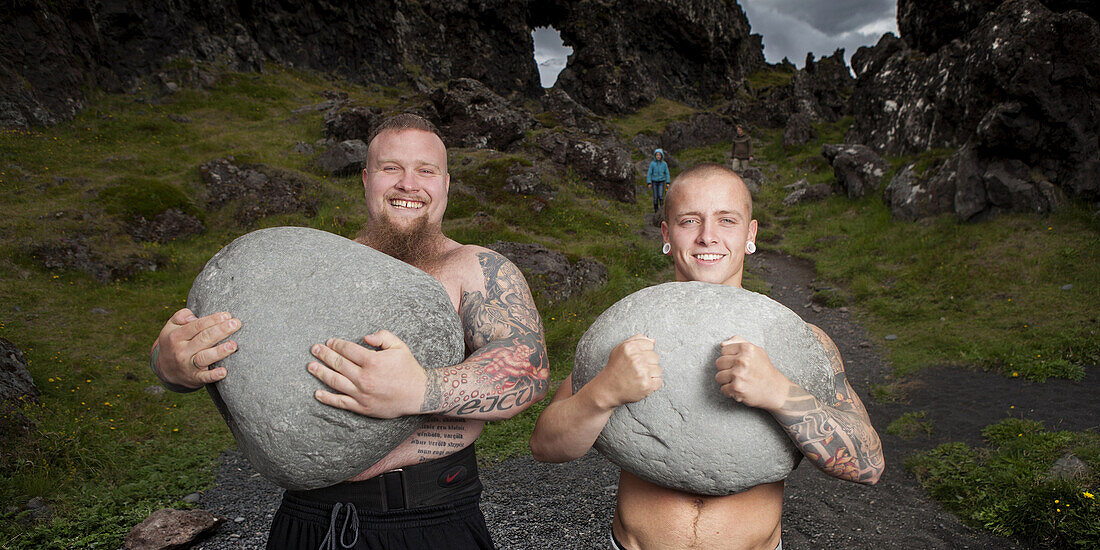 Brothers carrying heavy stones, Iceland.
