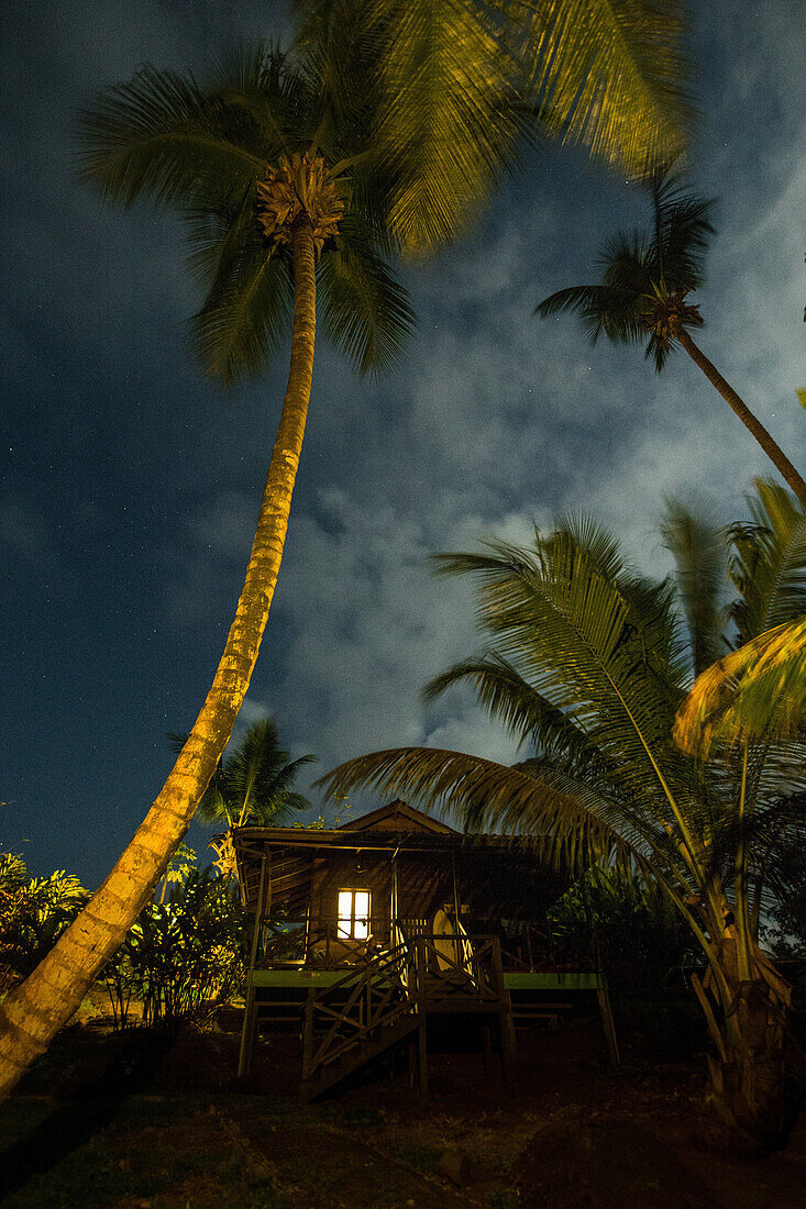 Small simple house on the beach between palm trees, Sao Tome, Sao Tome and Principe, Africa