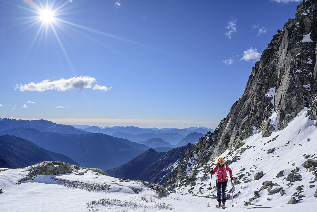 Woman back-country skiing ascending to Care Alto, Care Alto, Adamello group, Lombardia, Italy
