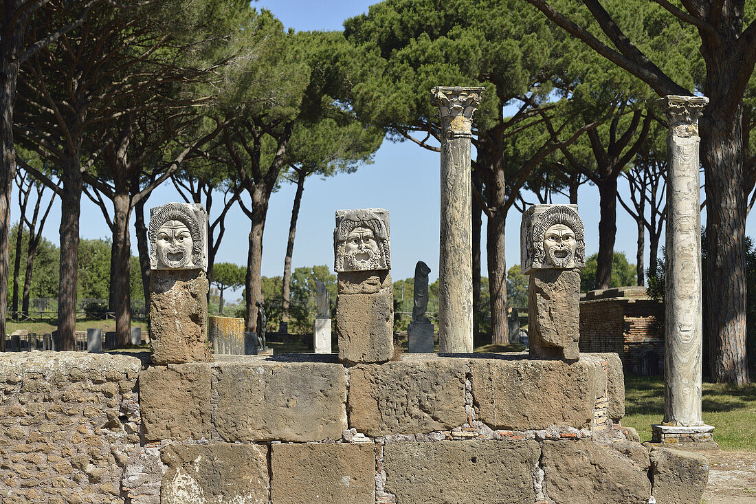 Rome. Italy. Ostia Antica. Marble theatrical masks at the rear of the theatre.