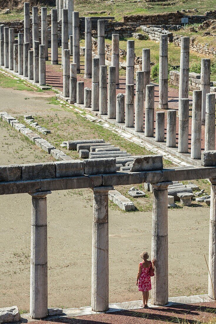 Exploring amongst the doric stoas that surround the stadium, at Ancient Messene, Messinia, Peloponnese, Greece.