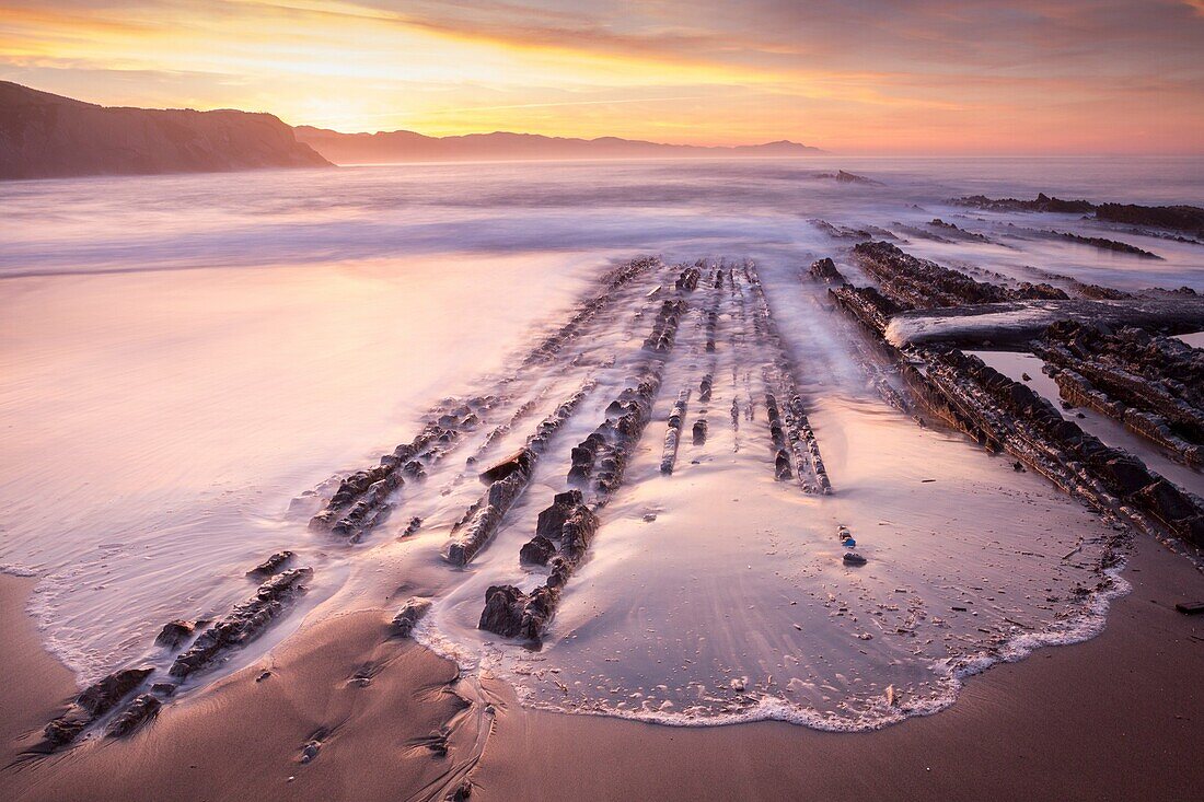 Sunset and Flysch in Iturun beach, Zumaia, Gipuzkoa, Basque Country