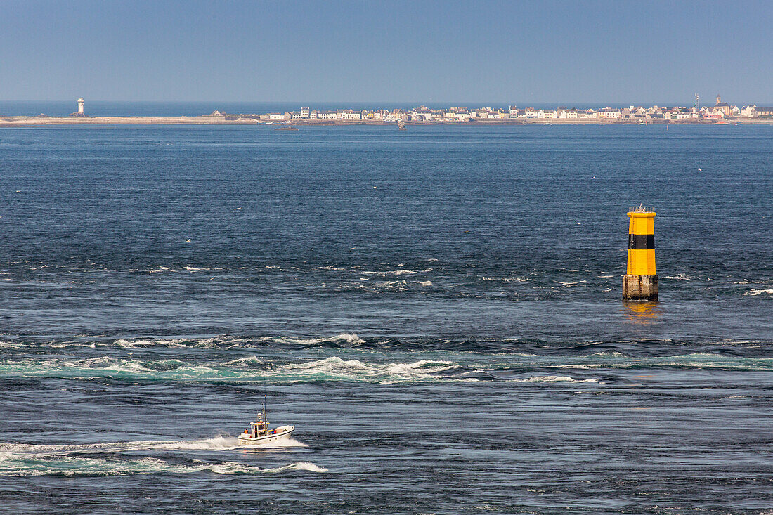 Raz de Sein meaning strong current of water,  Ile-de-Sein, fishing boat in strong current,promontory Pointe du Raz, Atlantic Ocean, Brittany, France