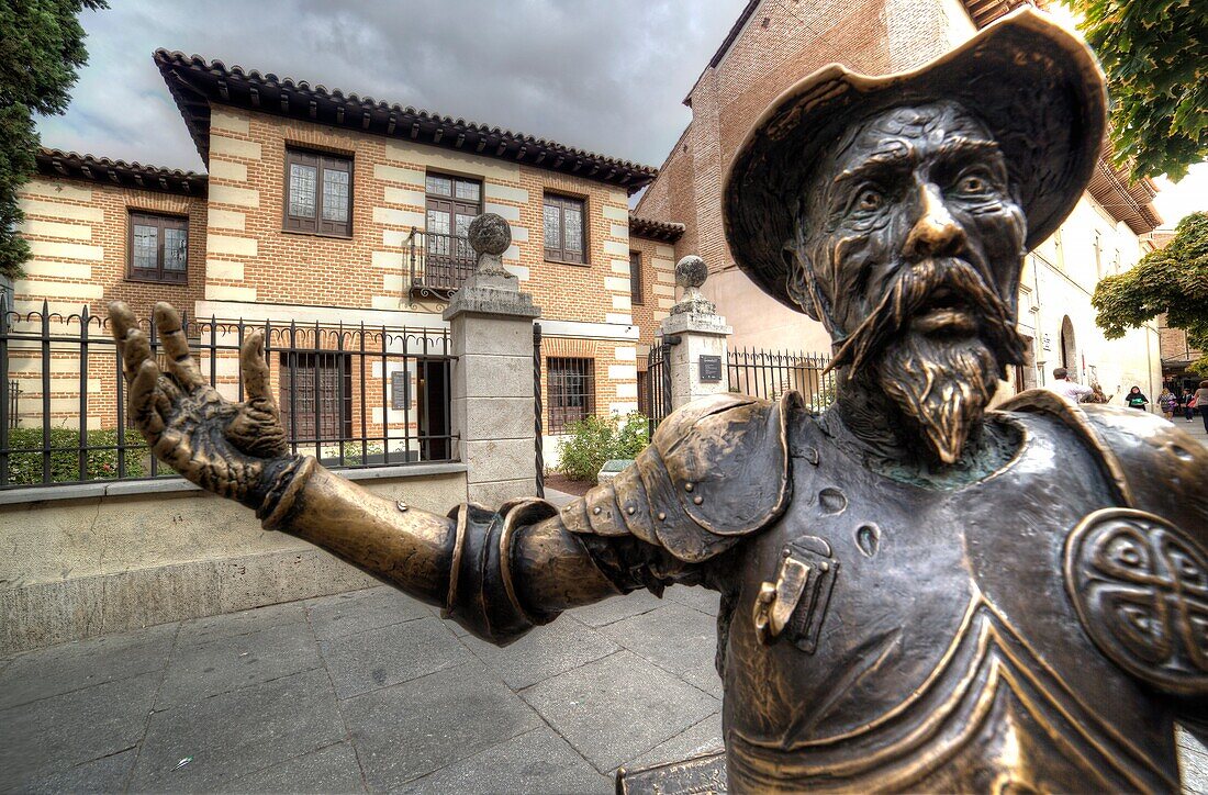 El quijote statue in front of Cervantes birth house-museum. alcala de henares. Spain. It is a monographic museum placed in Calle Mayor, and housed in the building where the writer was born. It brings to life the various areas of an affluent household duri