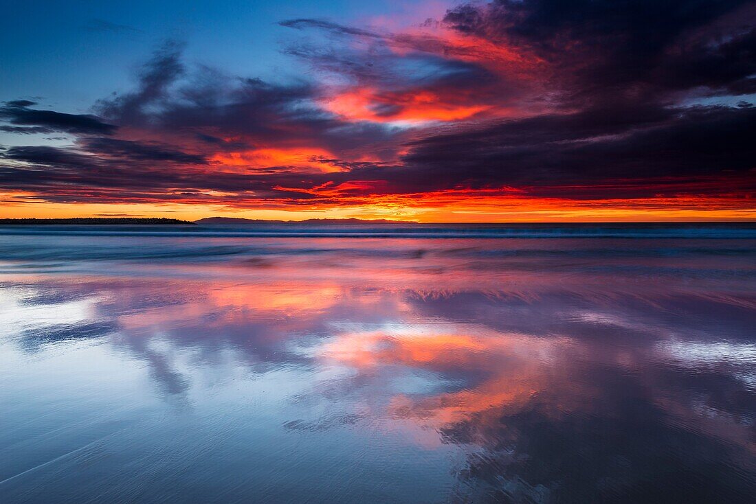 Sunset over the Channel Islands from Ventura State Beach, Ventura, California USA.