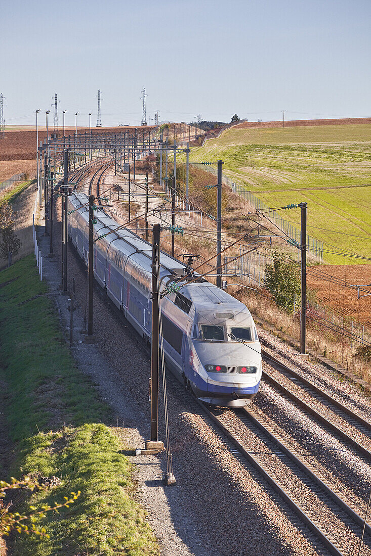 A TGV speeds through the Burgundy countryside of France.