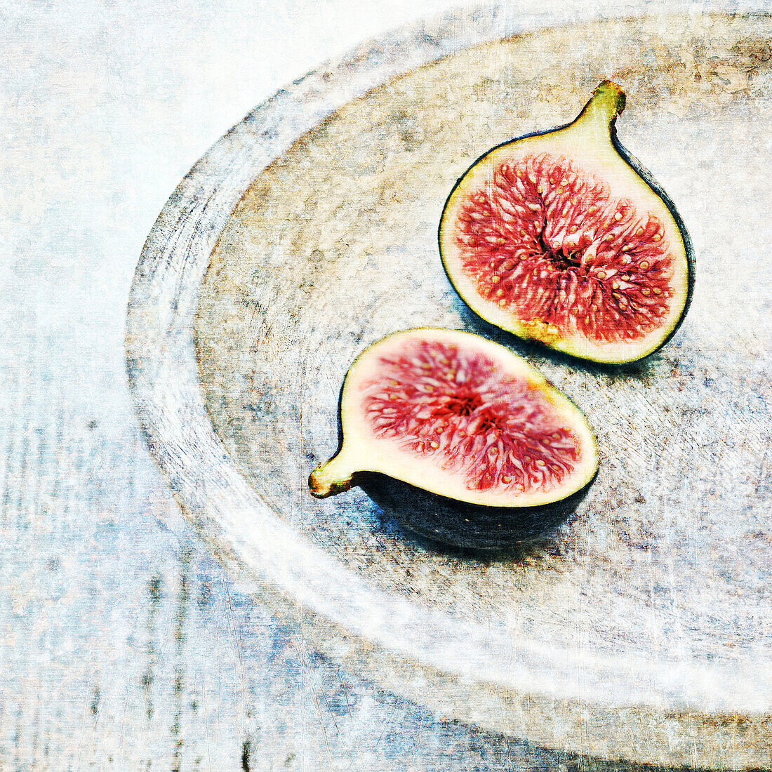 Figs on wooden plate.