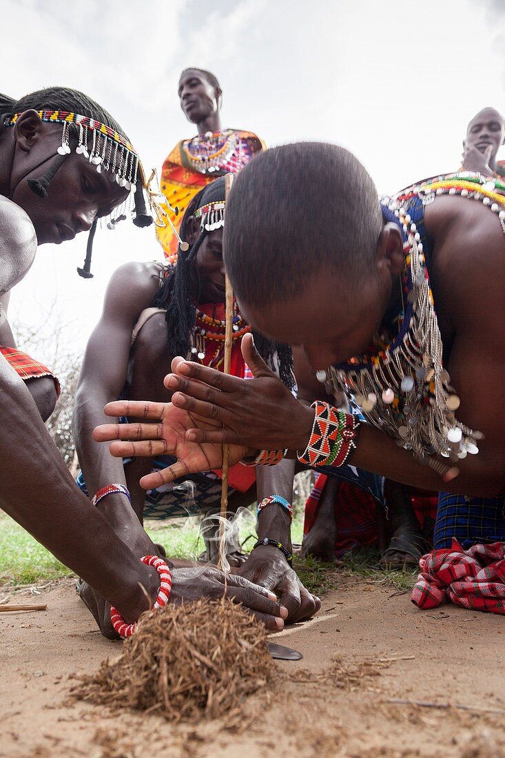 masai etnic people making traditional fire. masai mara national park. Kenya