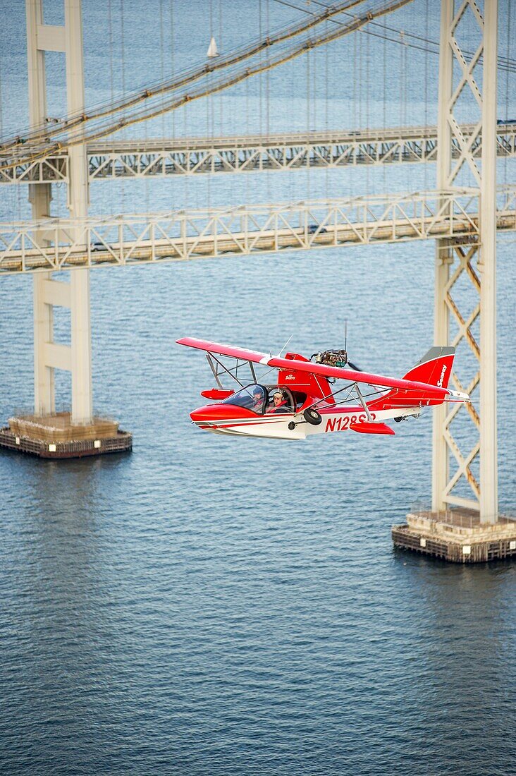 Searey a small seaplane flying near Chesapeake Bay Bridge, Maryland, USA.