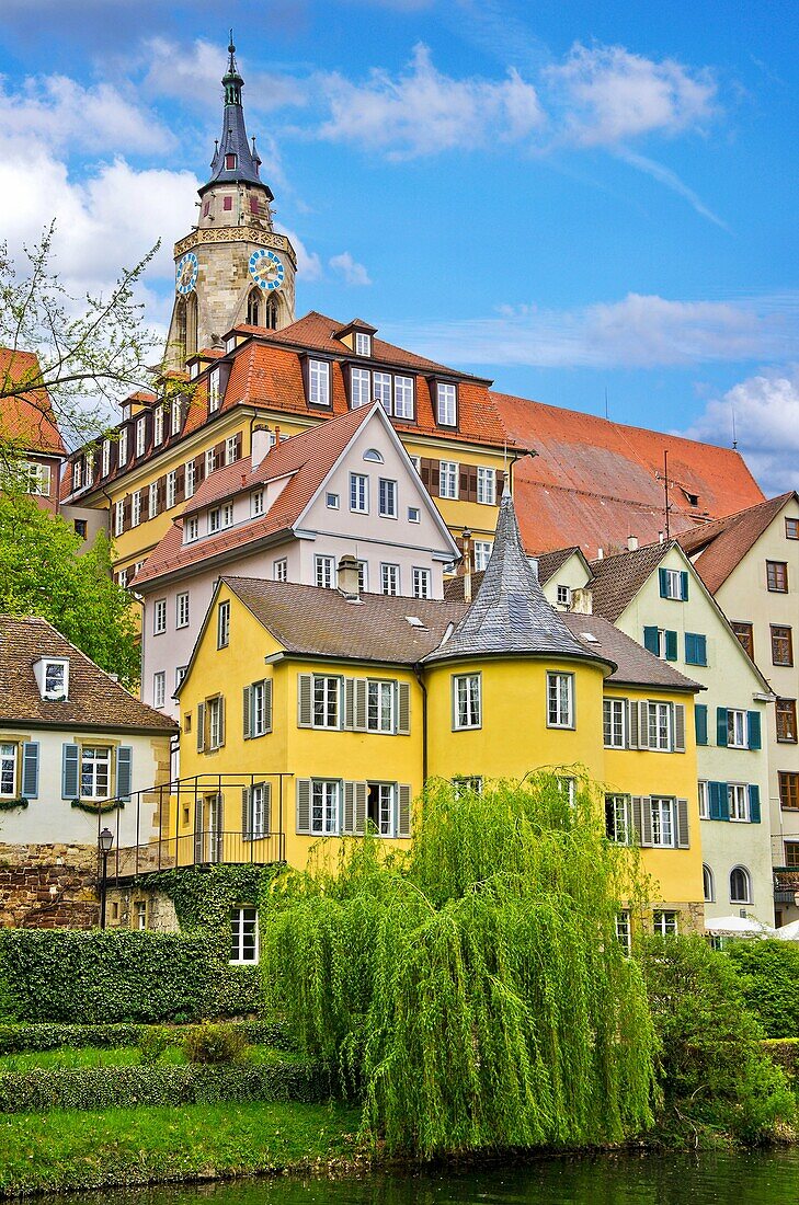 The Neckar river waterfront of Tubingen, Germany, showing its landmarks the Collegiate Church and Holderlinturm tower.