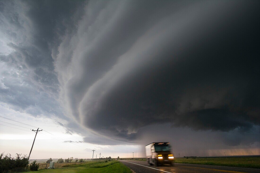 Supercell storm moves north of McCook Nebraska as a UPS driver zooms through falling hail stones.