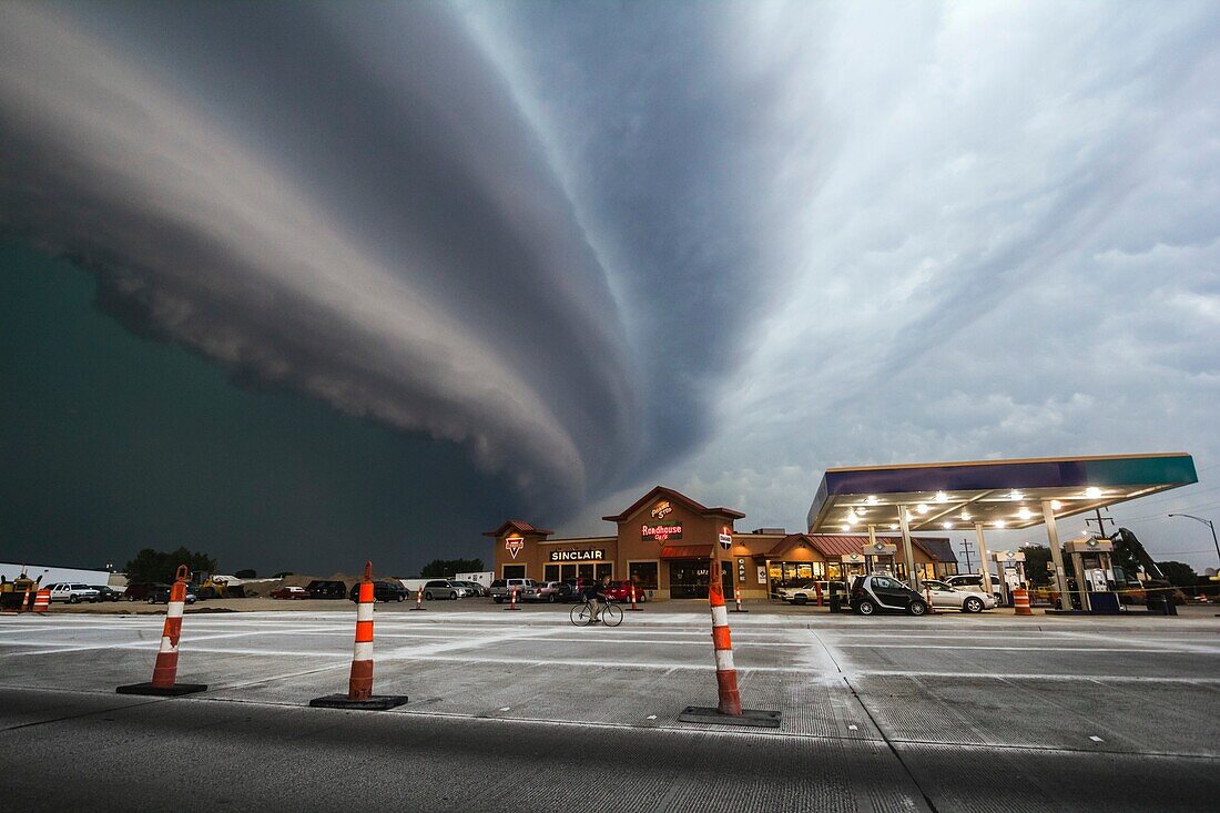 Very fast moving and severe bow echo moves down the highway from Redfield to Watertown South Dakota. Forward speed of the bow was around 60mph. At least 80mph winds accompanied the bow in areas, with many trees uprooted, poles snapped, gran bins destroyed