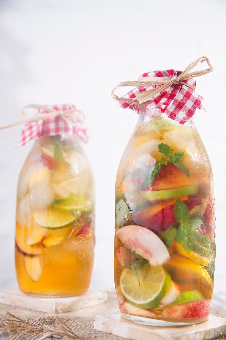 bottle of infused fruit tea with peach and lemon.