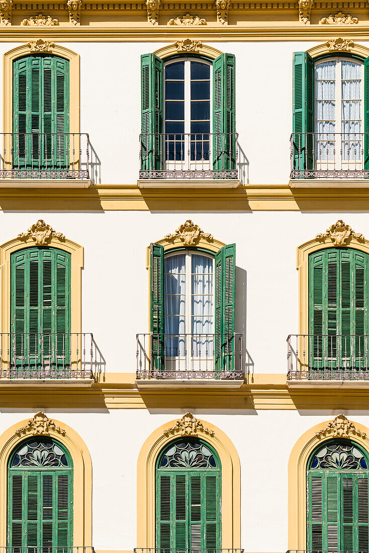 Front of an old house at the famous Plaza de la Merced, Malaga, Andalusia, Spain