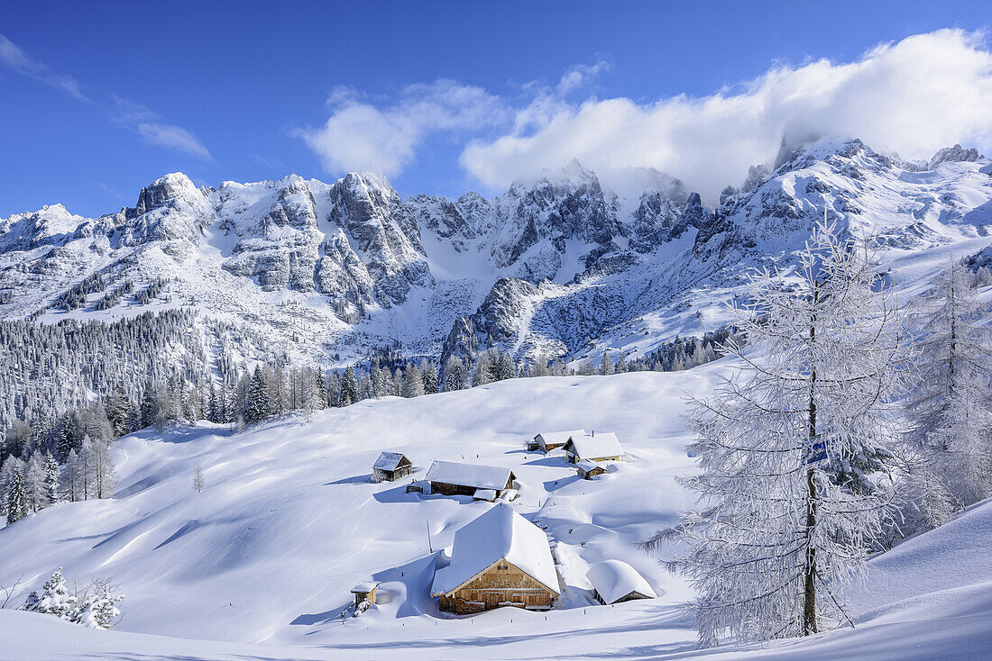 Snow-covered alpine huts in front of Gosau range, Gosau range, Dachstein, Salzburg, Austria