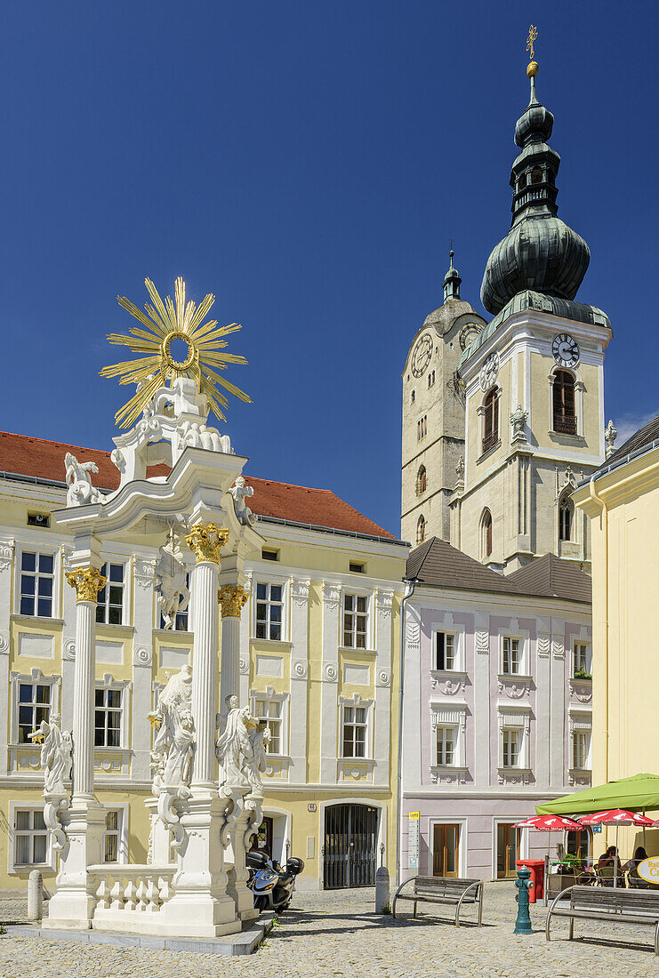 Main square with pillar Dreifaltigkeitssäule and church in background, Stein an der Donau, Krems, Wachau, Danube Bike Trail, UNESCO World Heritage Site Wachau, Lower Austria, Austria